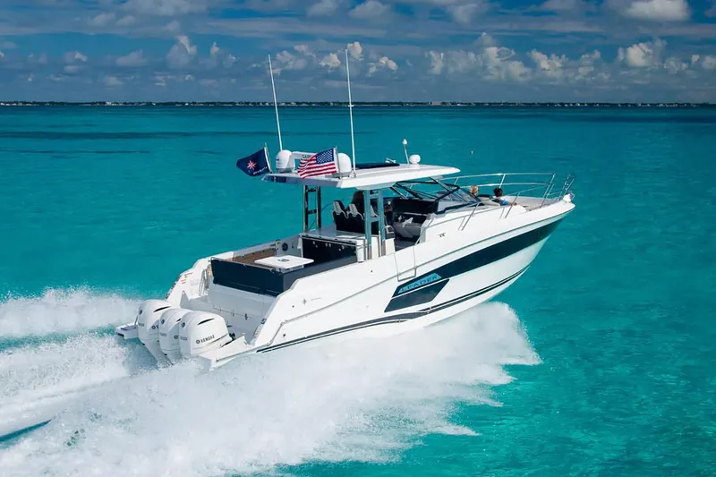 The Image of Manufacturer Provided Image: 2022 Jeanneau Leader 12.5 WA cruising on clear turquoise waters. - 1