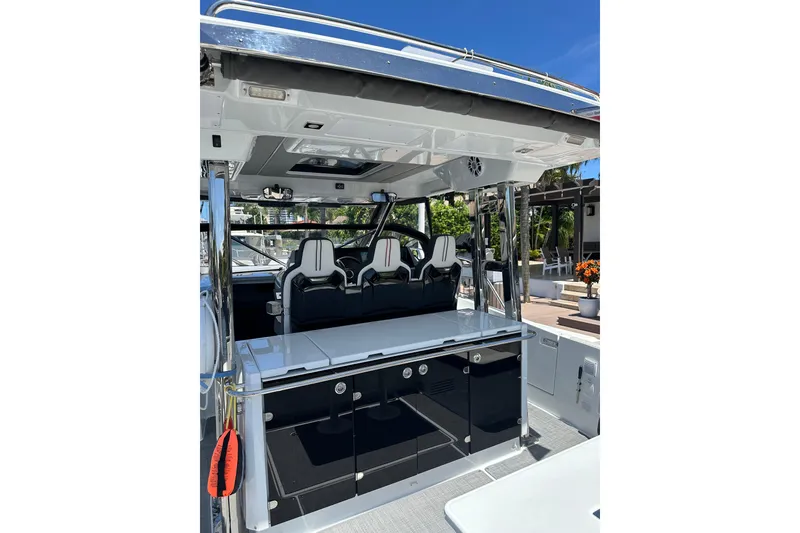 Slide: The Image of 2022 Jeanneau Leader 12.5 WA boat interior with sleek seating and modern design. - 21