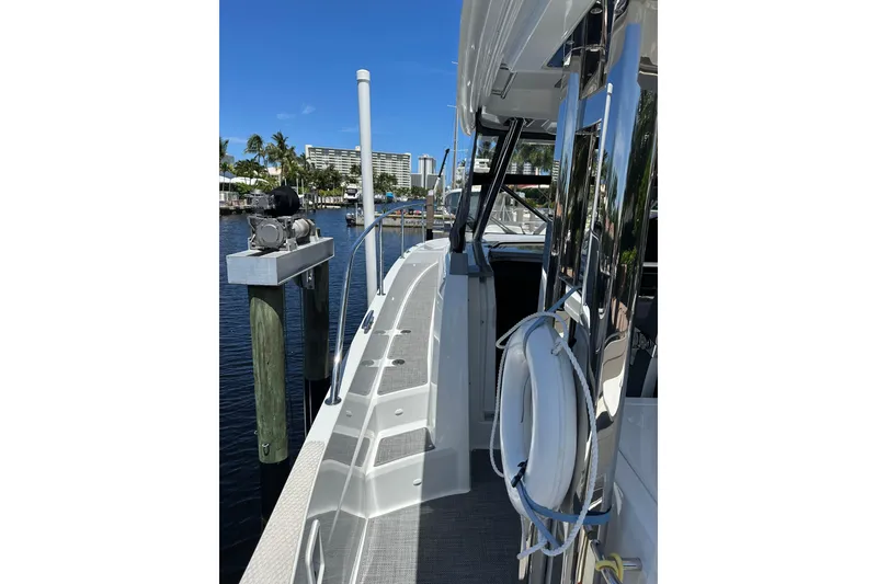 Slide: The Image of 2022 Jeanneau Leader 12.5 WA docked, showcasing sleek design and modern features. - 23