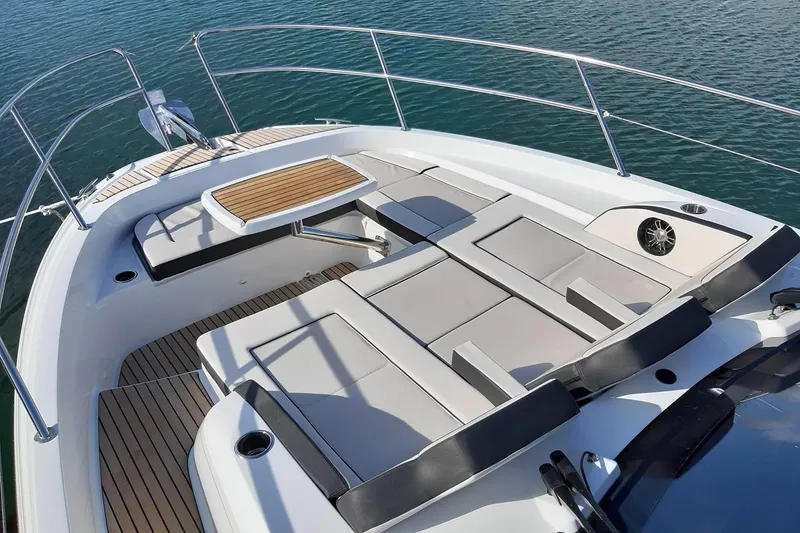 Slide: The Image of Manufacturer Provided Image: 2022 Jeanneau Leader 12.5 WA boat deck with seating and table. - 4