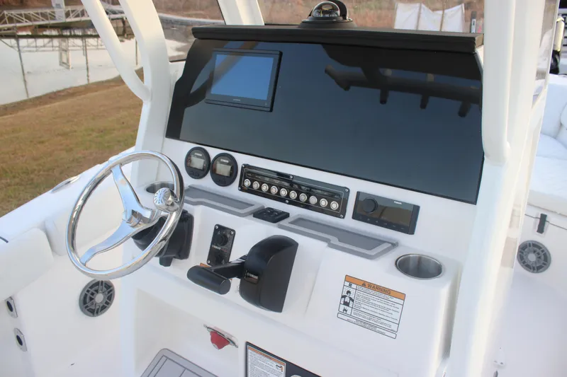 Slide: The Image of 2026 Sea Fox 228 Commander boat dashboard with steering wheel and control panel. - 19