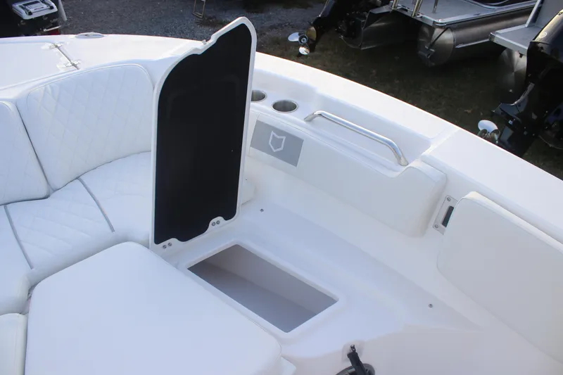 Slide: The Image of 2026 Sea Fox 228 Commander boat interior with white seating and storage compartment. - 25