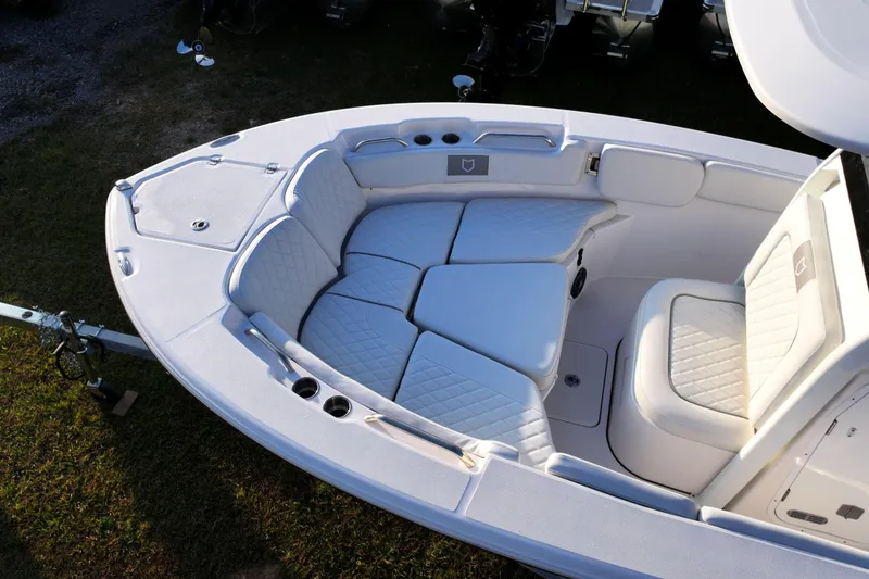 Slide: The Image of 2026 Sea Fox 228 Commander boat interior with cushioned seating and storage compartments. - 26