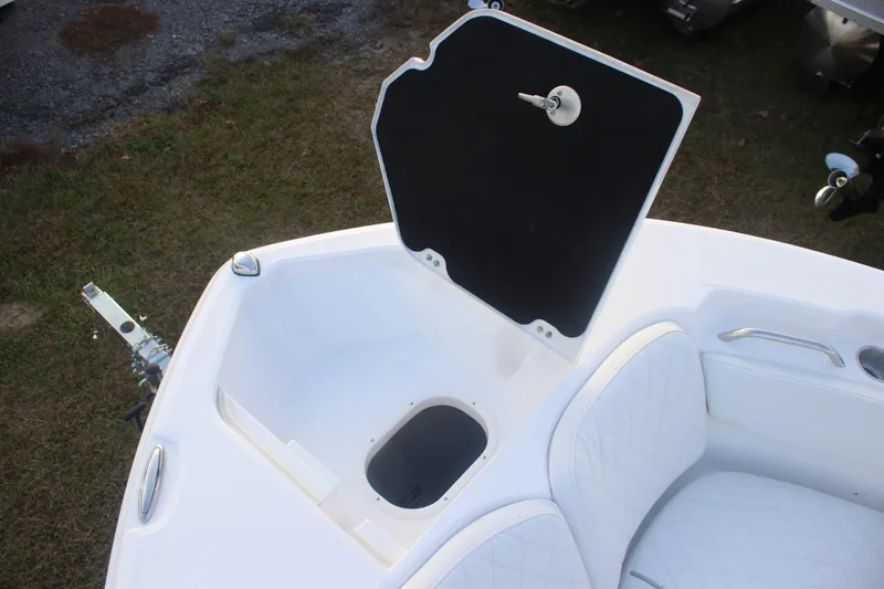 Slide: The Image of Open storage compartment on 2026 Sea Fox 228 Commander boat, featuring white cushioned seating. - 9