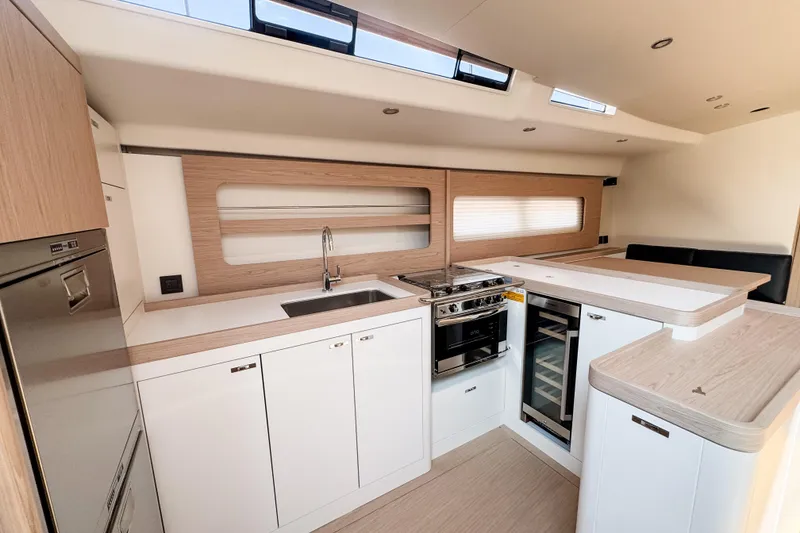 Slide: The Image of Modern kitchen interior of 2024 Beneteau First 53 yacht with sleek design and appliances. - 17