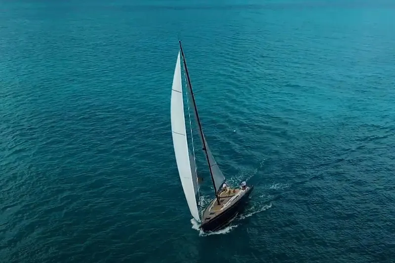 Slide: The Image of 2024 Beneteau First 53 sailing on clear blue ocean waters. - 2