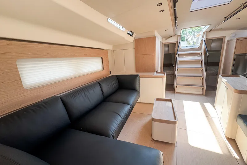 Slide: The Image of Luxurious interior of 2024 Beneteau First 53 yacht with modern design and comfortable seating. - 20