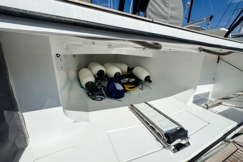 Slide: The Image of 2024 Beneteau First 53 yacht storage compartment with fenders and equipment. - 32