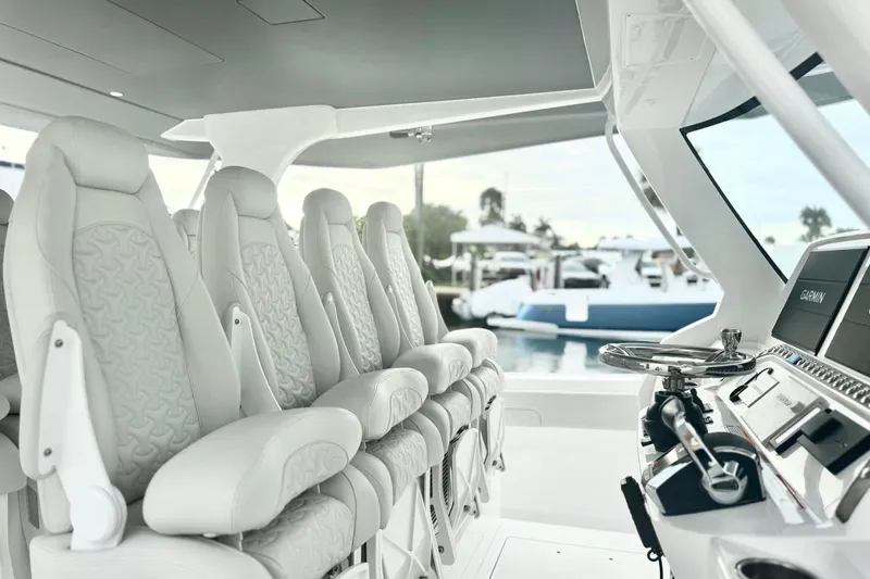 Slide: The Image of Luxurious interior of 2025 Intrepid 51 Panacea yacht with plush seating and advanced navigation. - 11