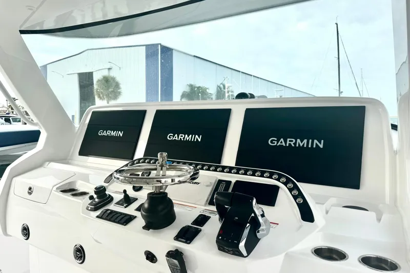 Slide: The Image of Helm of 2025 Intrepid 51 Panacea with Garmin displays and controls. - 13
