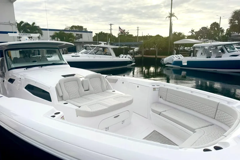 Slide: The Image of Luxurious 2025 Intrepid 51 Panacea boat with sleek design and spacious seating at marina. - 3