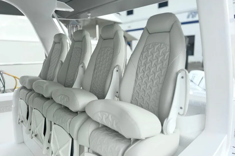 Slide: The Image of Luxurious seating on the 2025 Intrepid 51 Panacea boat, featuring elegant design and comfort. - 4
