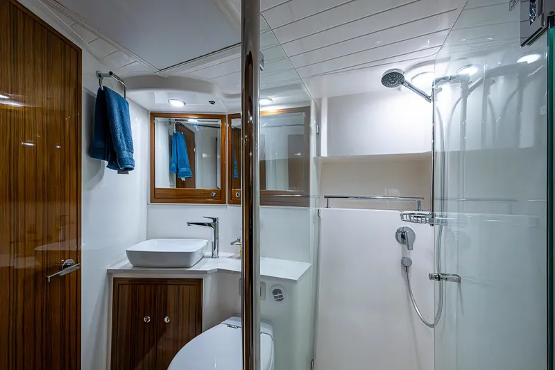 Slide: The Image of Luxurious bathroom in 2018 Maritimo M54 yacht with modern fixtures and glass shower. - 58