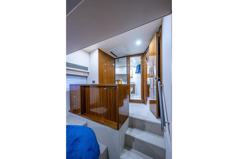 Slide: The Image of Luxurious 2018 Maritimo M54 yacht interior with wood finishes, bathroom, and bedroom. - 68