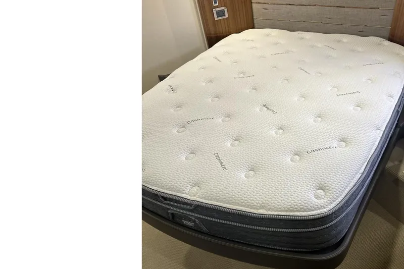 Slide: The Image of Luxurious cabin interior of 2018 Maritimo M54 yacht with blue bedding and wood accents. - 73