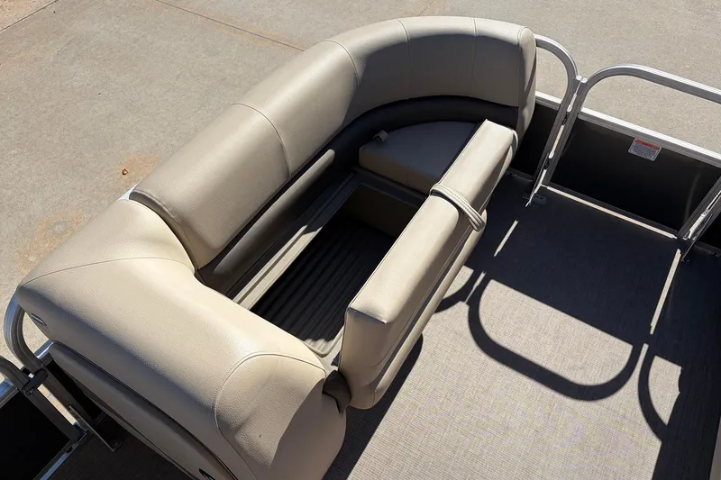 Slide: The Image of 2024 Sun Tracker Party Barge 18 DLX pontoon boat seating area, featuring beige upholstery. - 15