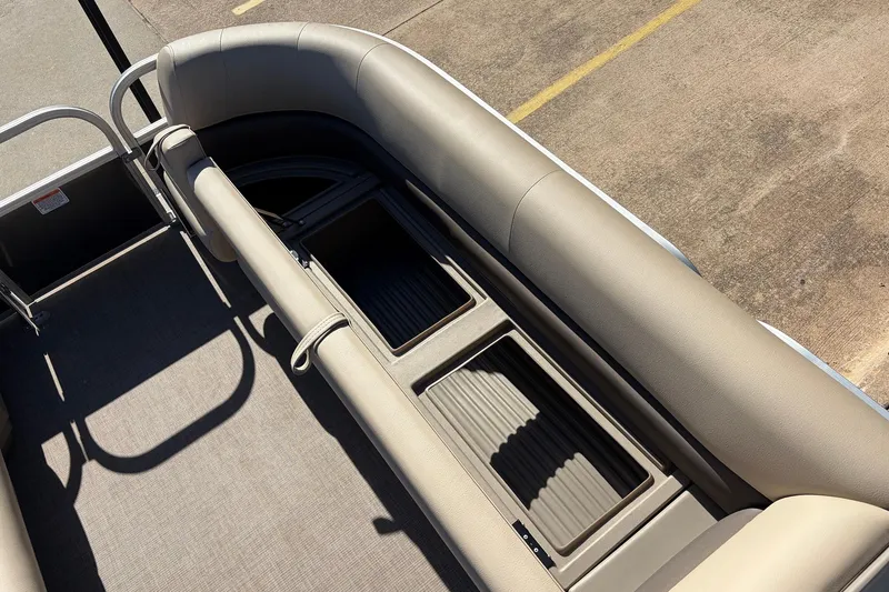 Slide: The Image of 2024 Sun Tracker Party Barge 18 DLX interior seating and storage compartments. - 21