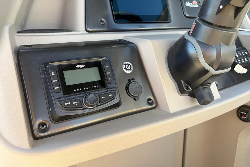 Slide: The Image of 2024 Sun Tracker Party Barge 18 DLX dashboard with Wet Sounds audio system. - 28