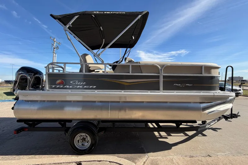 Slide: The Image of 2024 Sun Tracker Party Barge 18 DLX pontoon boat with canopy on trailer. - 5