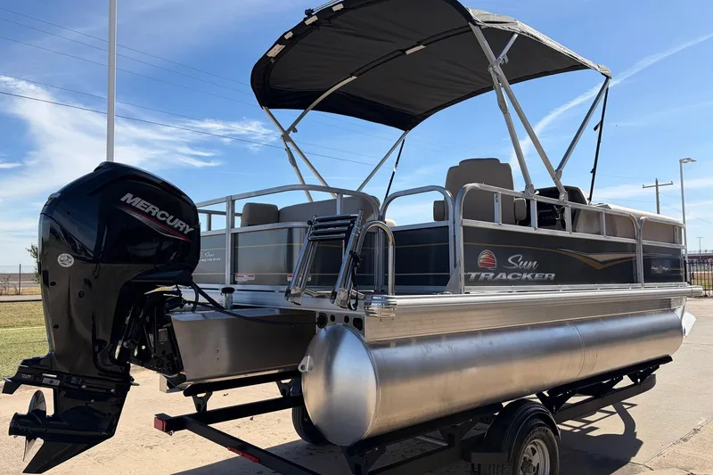 Slide: The Image of 2024 Sun Tracker Party Barge 18 DLX pontoon boat with Mercury outboard motor. - 6