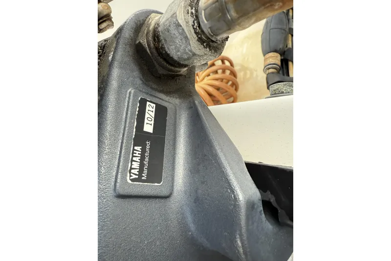 Slide: The Image of Close-up of a Yamaha engine part on a 2004 Boston Whaler 190 Nantucket boat. - 21