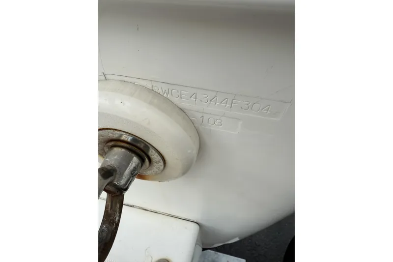 Slide: The Image of 2004 Boston Whaler 190 Nantucket boat hull identification number close-up. - 22
