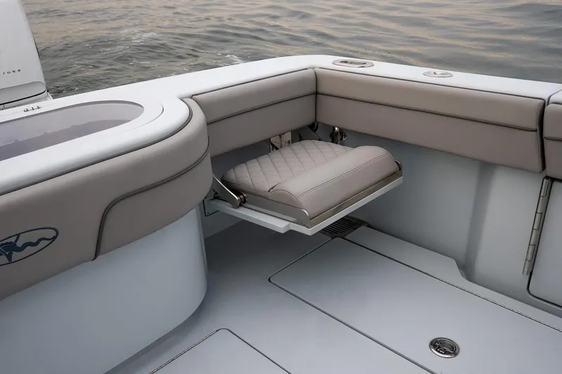 Slide: The Image of 2023 Valhalla Boatworks V-33 interior with foldable seat and sleek design. - 11
