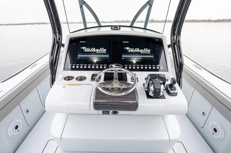 Slide: The Image of 2023 Valhalla Boatworks V-33 helm with dual displays and modern controls. - 20
