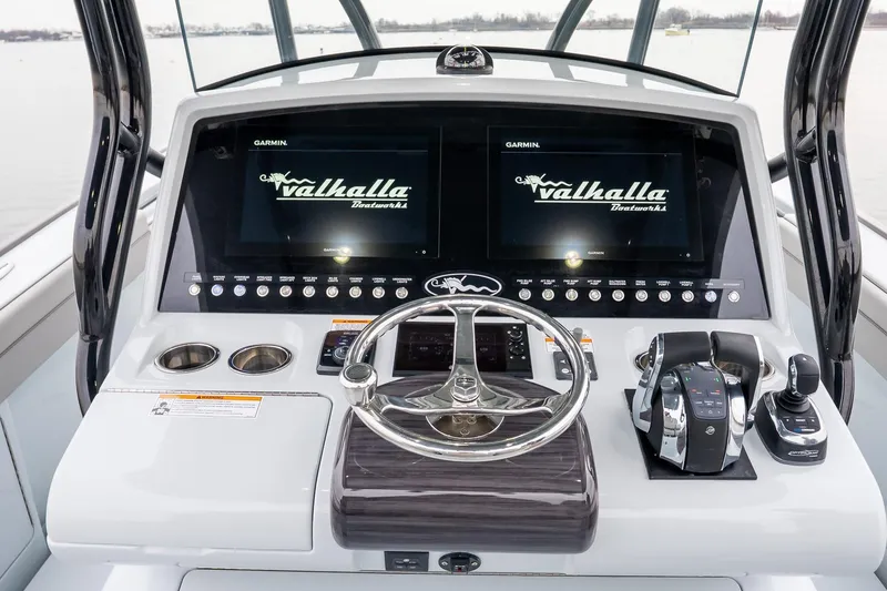 Slide: The Image of 2023 Valhalla Boatworks V-33 helm with dual Garmin displays and modern controls. - 21