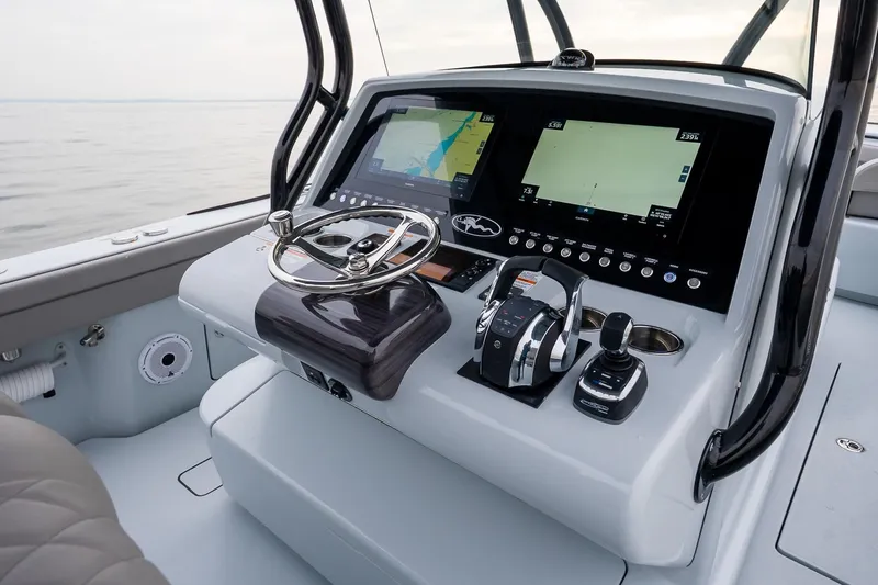 Slide: The Image of 2023 Valhalla Boatworks V-33 helm with advanced navigation displays and controls. - 22