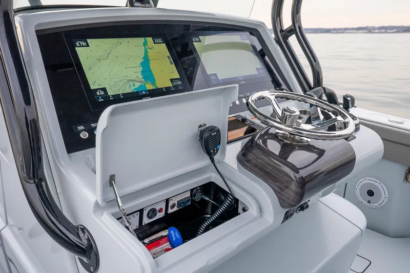 Slide: The Image of 2023 Valhalla Boatworks V-33 helm with advanced navigation displays and controls. - 23