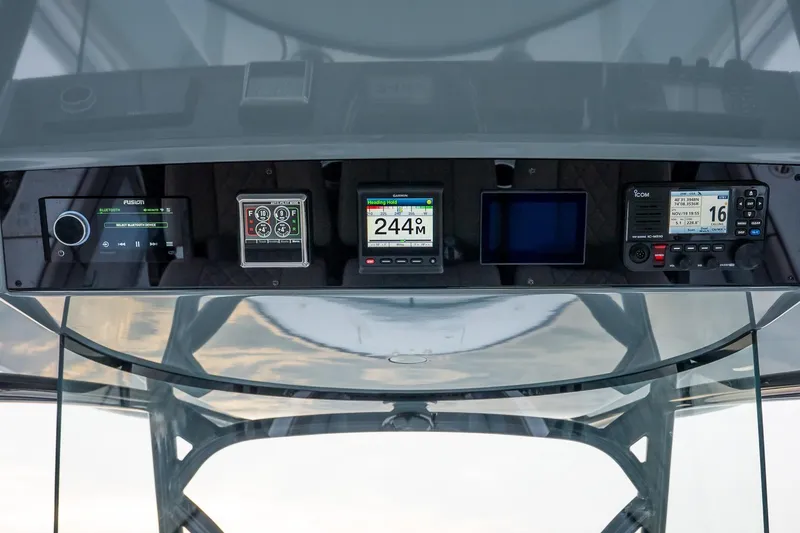 Slide: The Image of 2023 Valhalla Boatworks V-33 dashboard with advanced navigation and communication systems. - 25