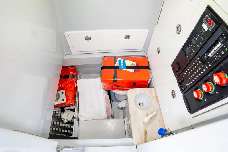 Slide: The Image of 2023 Valhalla V-33 boat interior with safety gear and control panel. - 27