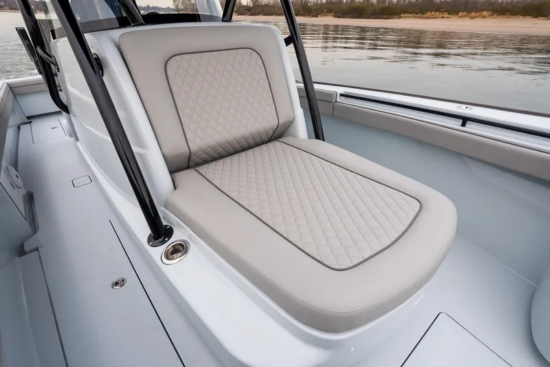 Slide: The Image of 2023 Valhalla Boatworks V-33 interior with cushioned seating and sleek design. - 31