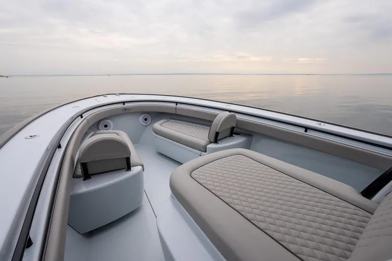 Slide: The Image of 2023 Valhalla Boatworks V-33 interior with elegant seating on calm water. - 32