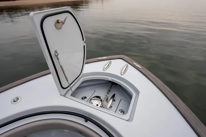 Slide: The Image of 2023 Valhalla Boatworks V-33 anchor compartment open on calm water. - 35