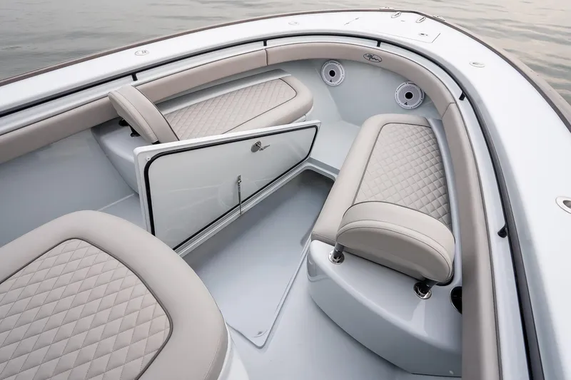 Slide: The Image of 2023 Valhalla Boatworks V-33 interior with elegant seating and storage compartment. - 37