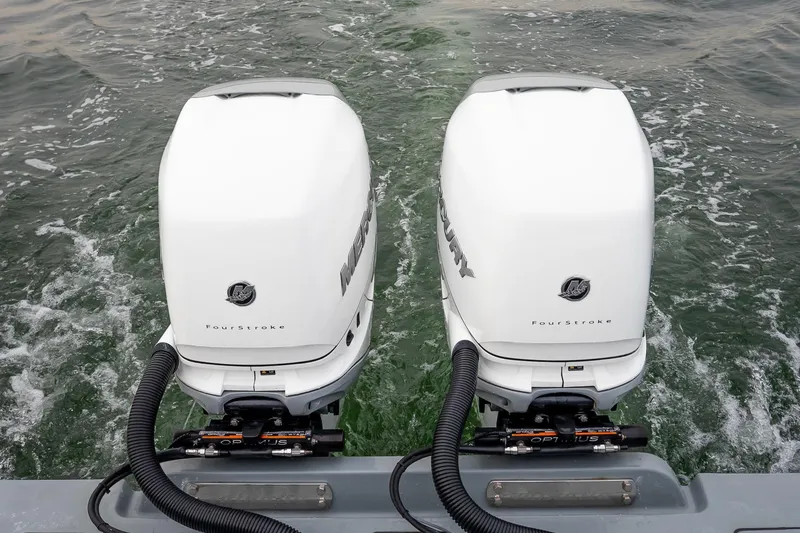 Slide: The Image of Twin Mercury FourStroke engines on 2023 Valhalla Boatworks V-33, cruising through water. - 5