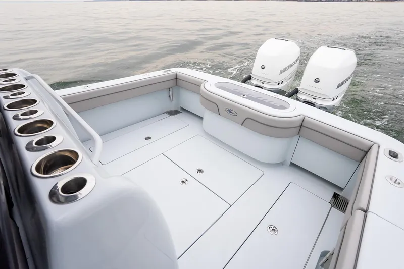 Slide: The Image of 2023 Valhalla Boatworks V-33 with twin Mercury engines on calm water. - 8