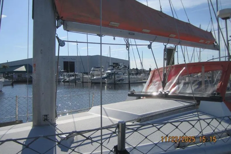Slide: The Image of 1986 Catalina 30 MkII sailboat docked at marina with orange sail cover. - 11