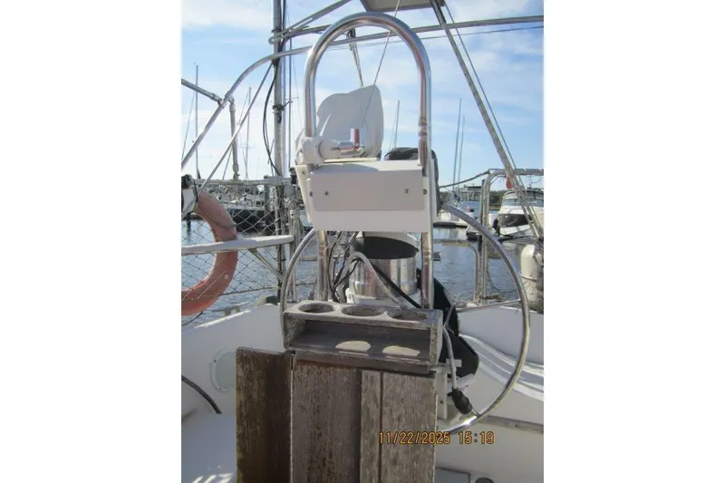 Slide: The Image of Cockpit of 1986 Catalina 30 MkII sailboat with steering wheel and marina view. - 20