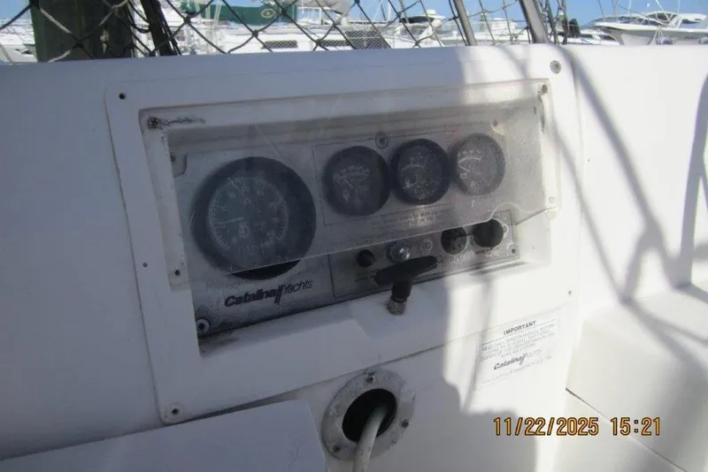 Slide: The Image of Control panel of a 1986 Catalina 30 MkII yacht with gauges and switches. - 27
