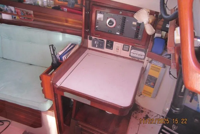 Slide: The Image of Interior of a 1986 Catalina 30 MkII sailboat with navigation station and seating area. - 31