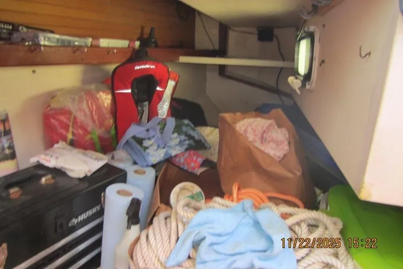 Slide: The Image of Cluttered interior of 1986 Catalina 30 MkII sailboat with life jacket and ropes. - 34