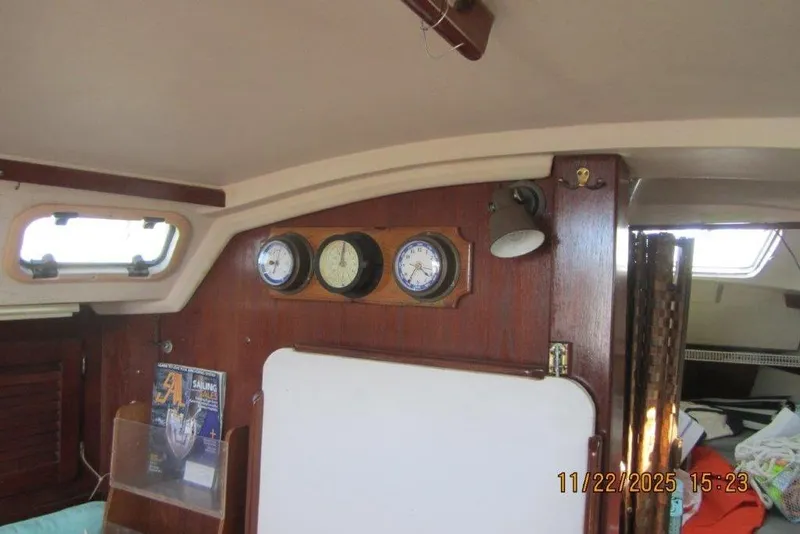 Slide: The Image of Interior of 1986 Catalina 30 MkII sailboat with gauges and wooden paneling. - 36