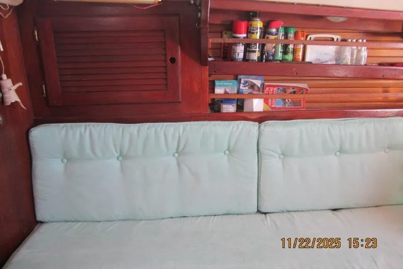 Slide: The Image of Interior of 1986 Catalina 30 MkII sailboat with cushions and storage shelves. - 38