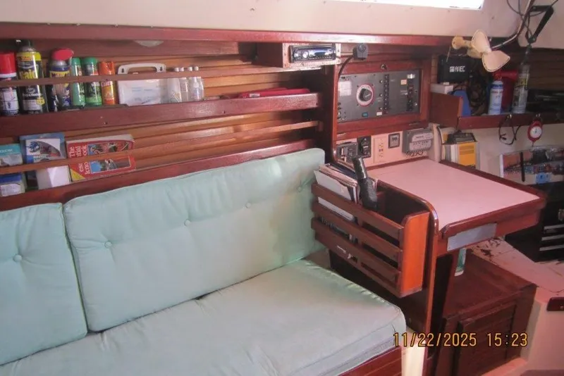 Slide: The Image of Interior of 1986 Catalina 30 MkII sailboat with navigation station and storage shelves. - 39