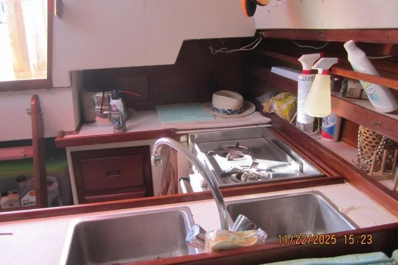 Slide: The Image of Interior of 1986 Catalina 30 MkII sailboat kitchen with sink and stove. - 41