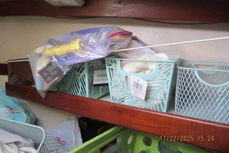 Slide: The Image of Storage baskets on a Catalina 30 MkII sailboat shelf, dated November 22, 2025. - 47