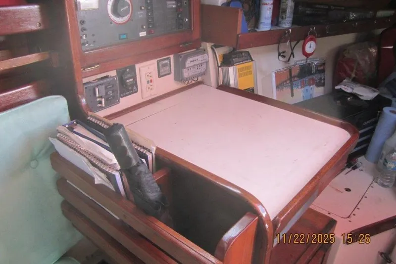 Slide: The Image of Navigation station of a 1986 Catalina 30 MkII sailboat with instruments and storage. - 56